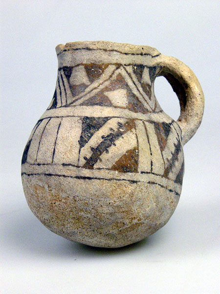 a jug is shown with designs on the outside