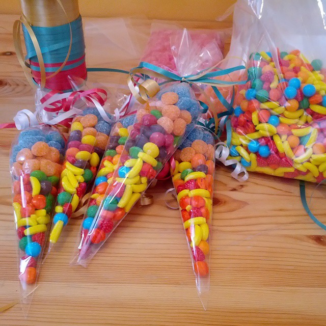 several candy cones are in a group on the table