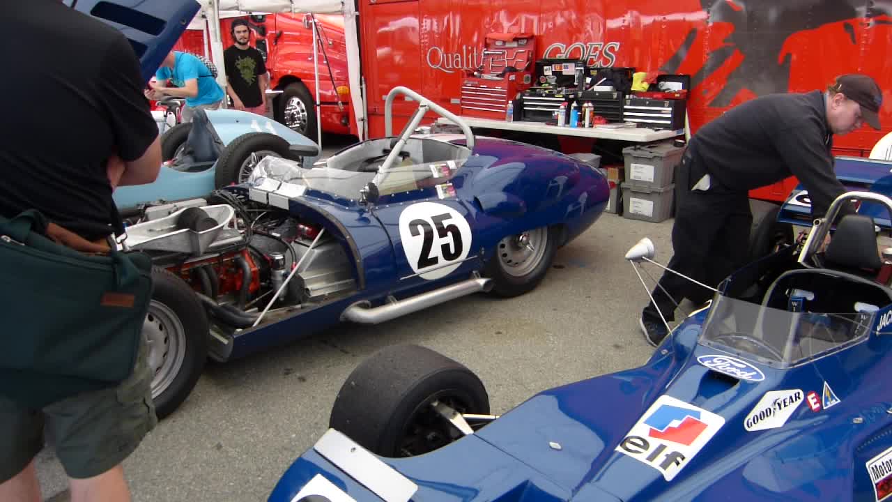 a race car sitting next to other race cars
