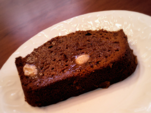 a white plate topped with a piece of cake