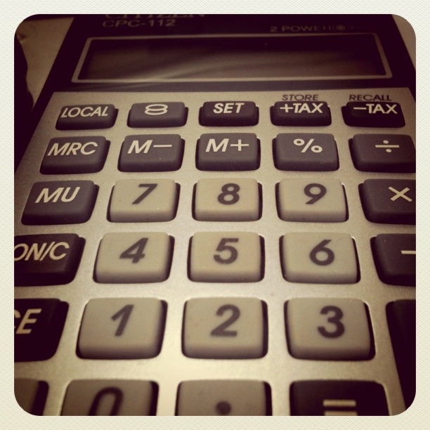 a gray calculator with numbers on the top and bottom half