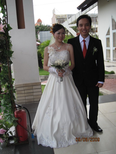 an asian couple posing for a wedding po