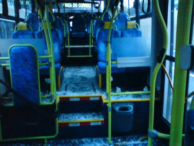 the inside of a blue bus with its doors open