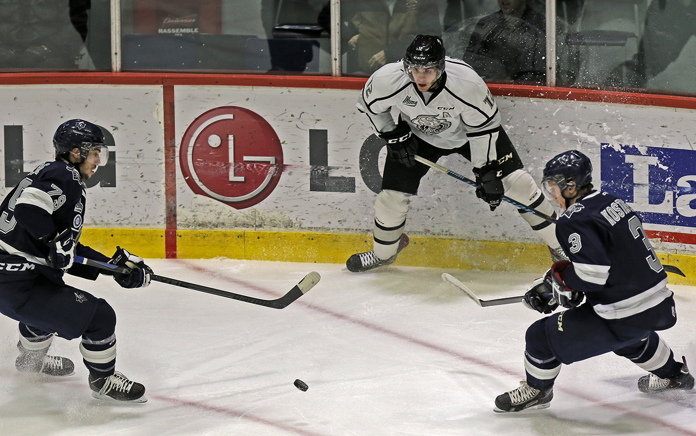 hockey player in the motion of throwing ball at him