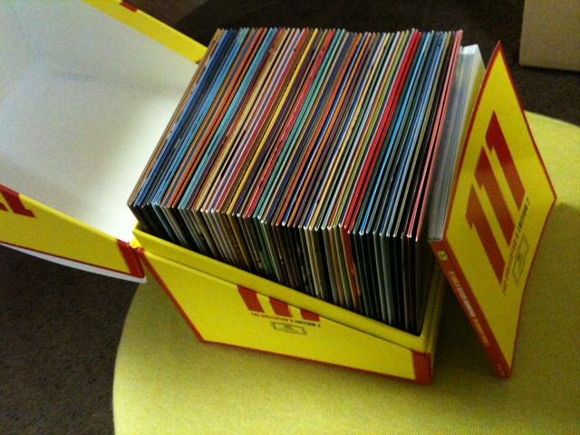 a stack of dvds that are stacked in a box