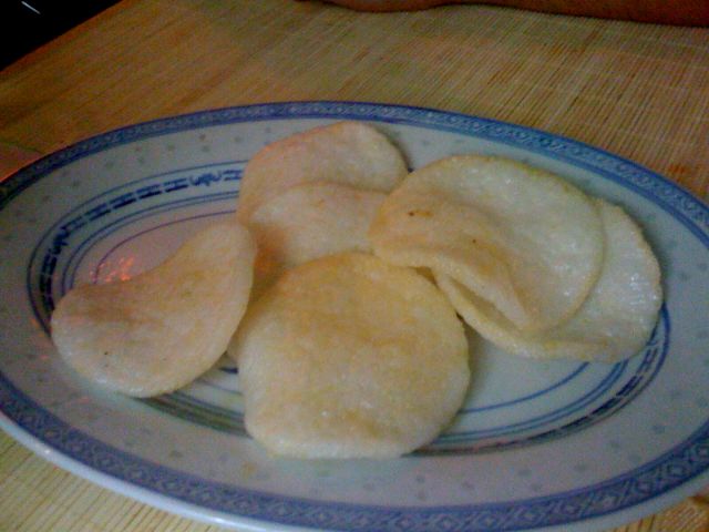 a plate full of sliced dumplings sitting on a wooden table