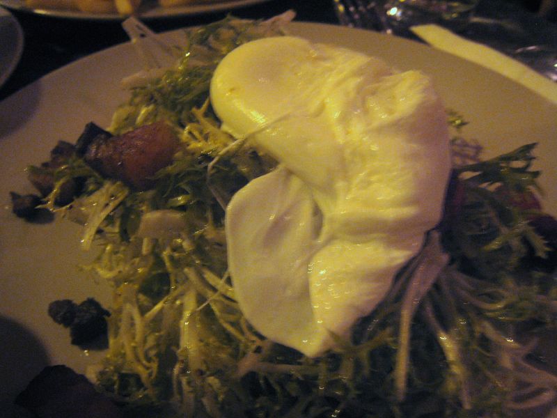 a plate with a large salad on top of it