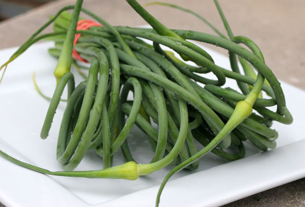 a large white plate topped with green beans