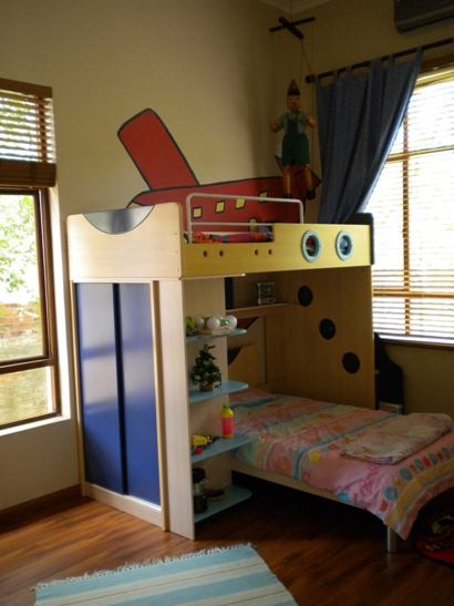 a childs bed that has bunk beds built into it