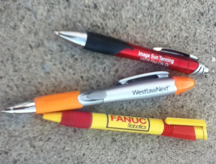 two pens sitting on the floor near one another