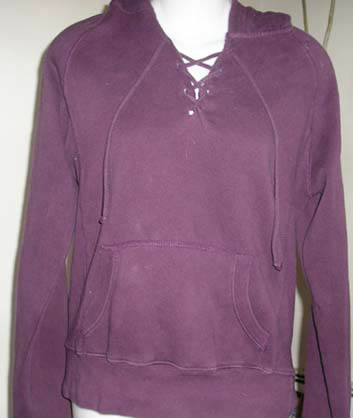 a purple hooded sweatshirt sits on top of a mannequin