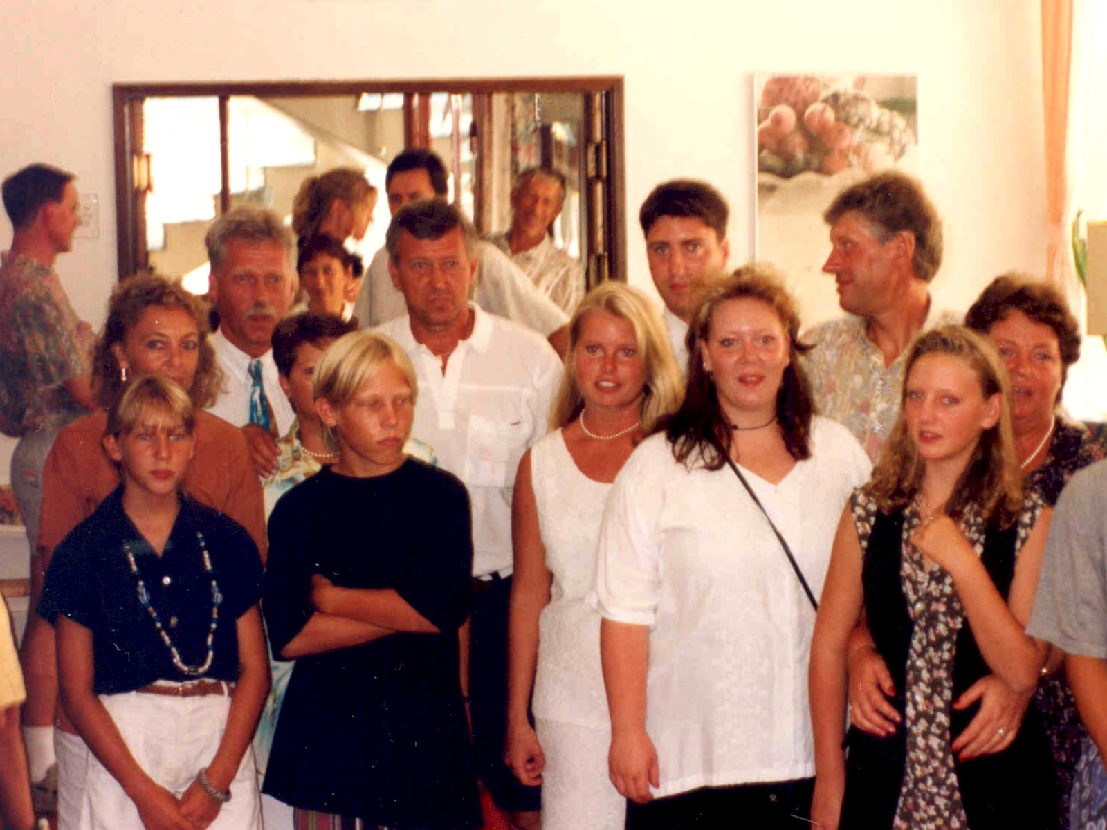 a group of people standing together in a room