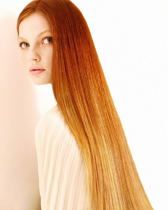 a red haired woman with long, straight hair