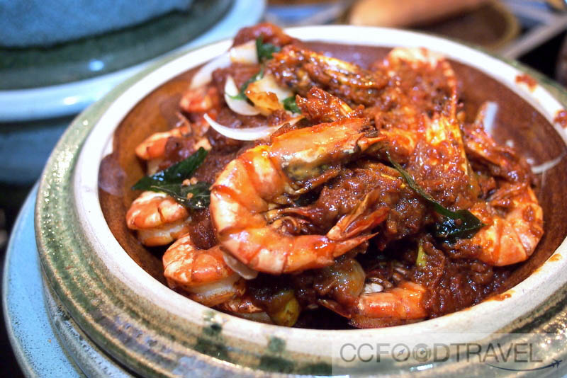 a dish of shrimp and pepper sauce on a plate