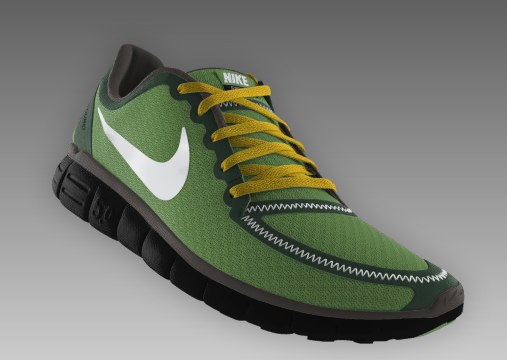 a green nike shoe with a yellow and white shoelace