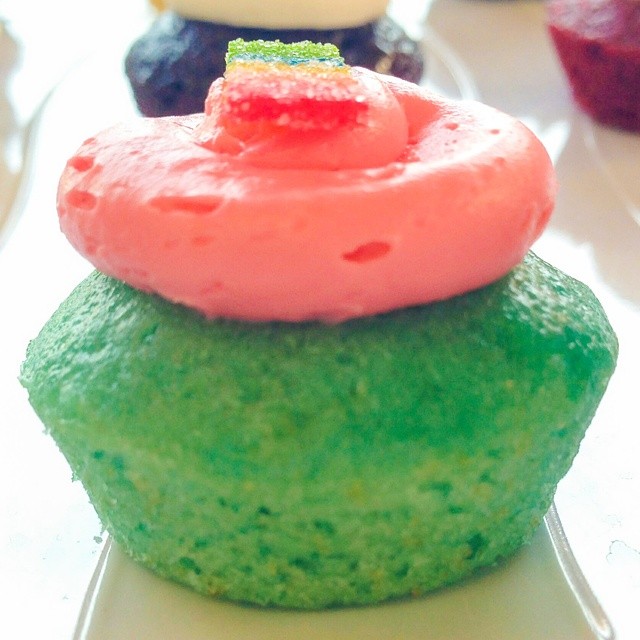 an image of a cupcake with different colors on top