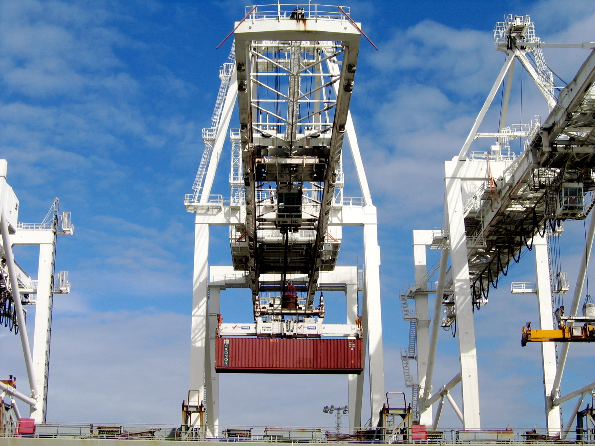 a crane sits next to a tall structure