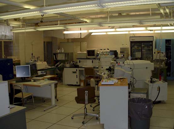 an old factory with electronic equipment and various tables