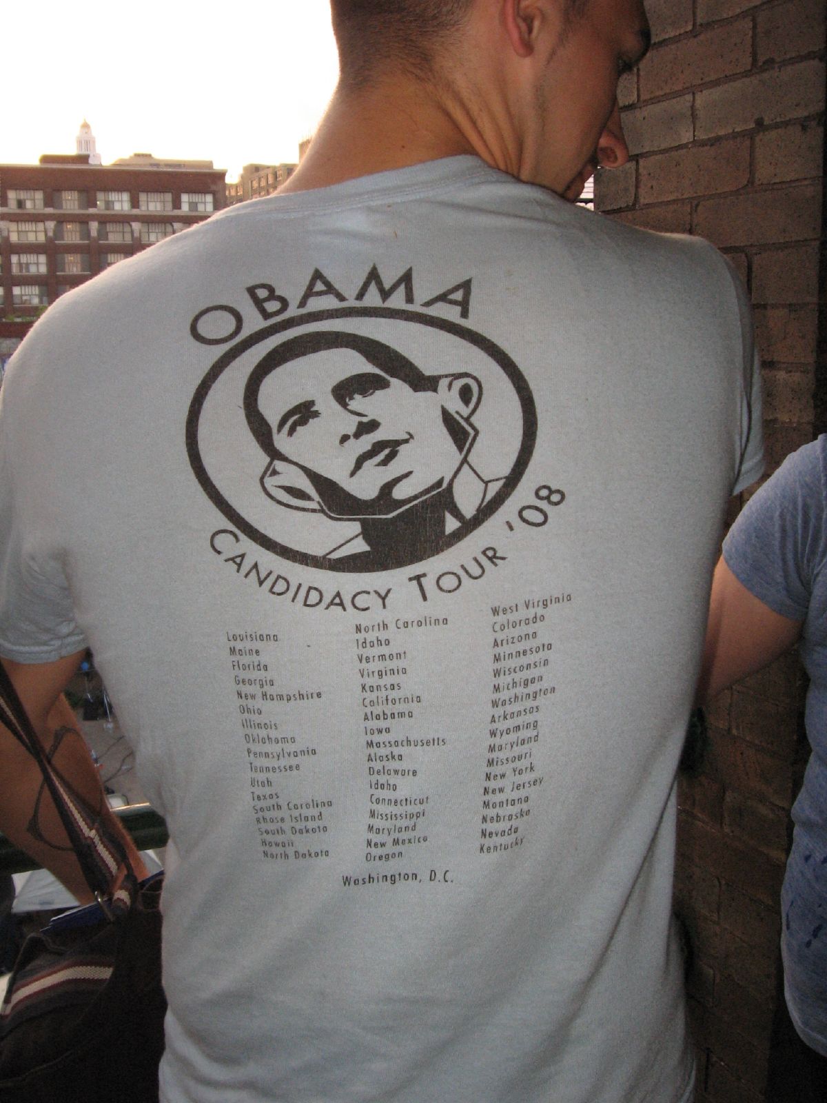 a man is wearing a obama campaign tour shirt