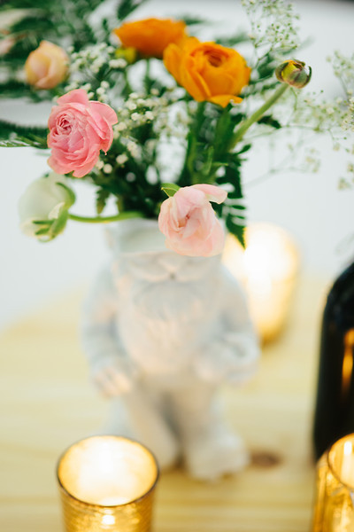 a vase full of flowers on a wooden table