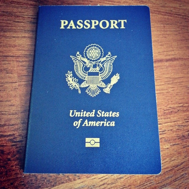 the blue united states us passport is sitting on a table