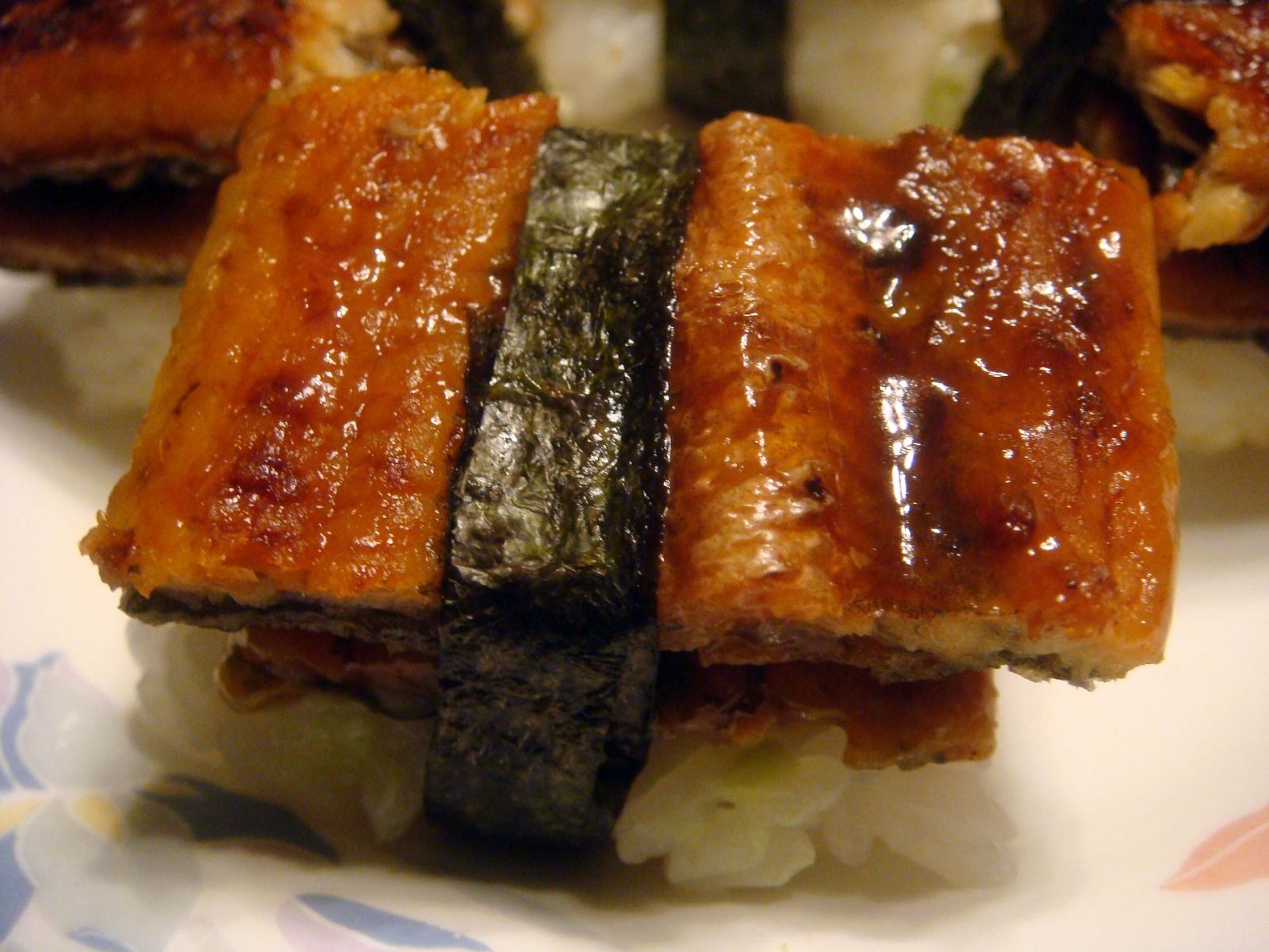 small pieces of sushi sit on top of white rice