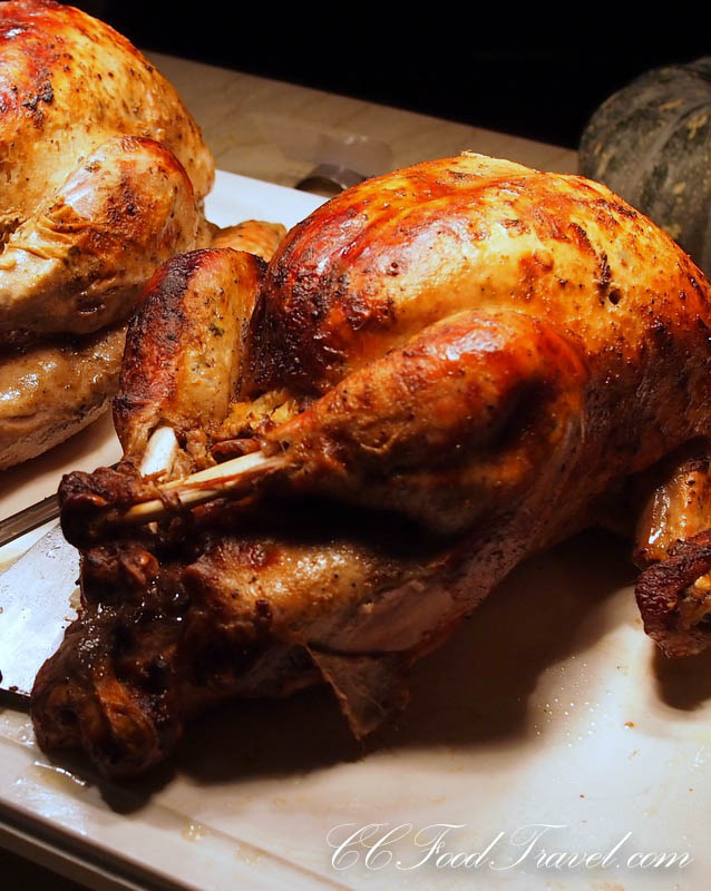 some chicken sitting on a  board and knife