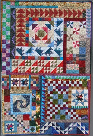 a quilt in red, green, blue, and white