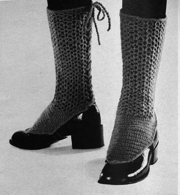black and white pograph of a woman wearing high boots