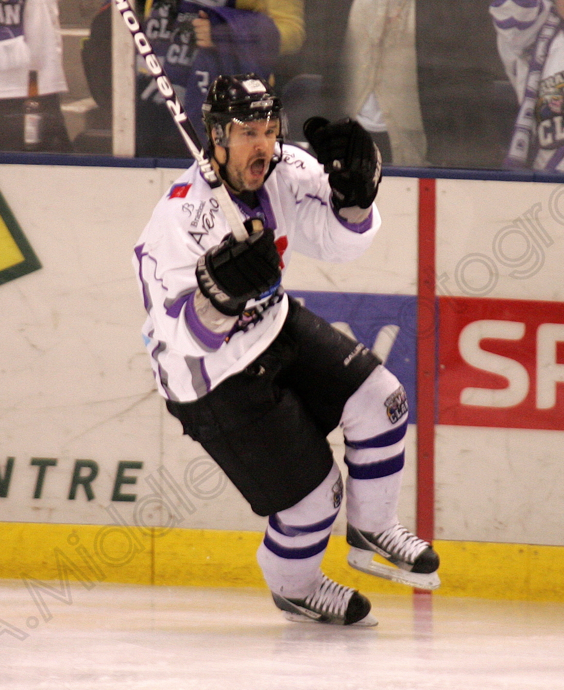 the hockey player runs on the ice during the game