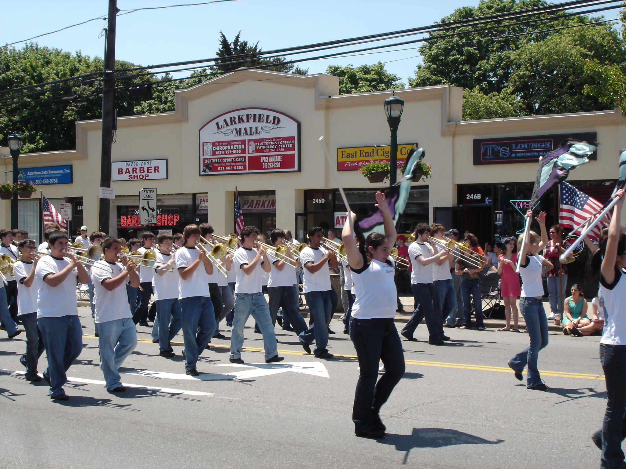 marching band performing on street in city area