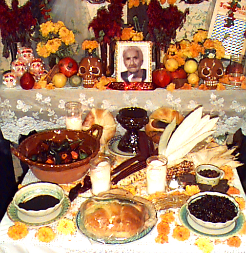 a table full of pumpkin pie and other treats