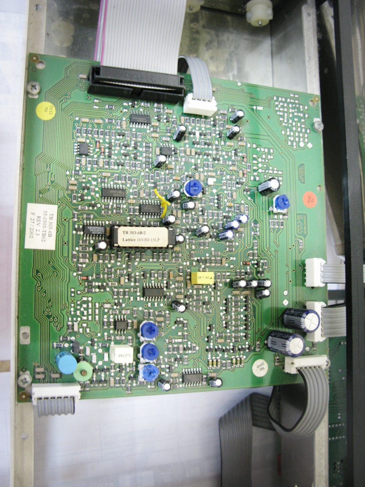 close up of electronic board with multiple components attached