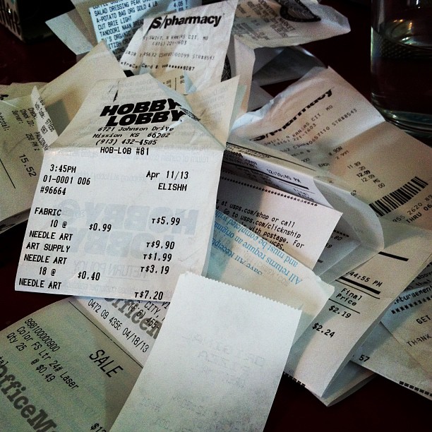 a pile of torn concert tickets laying on top of a table