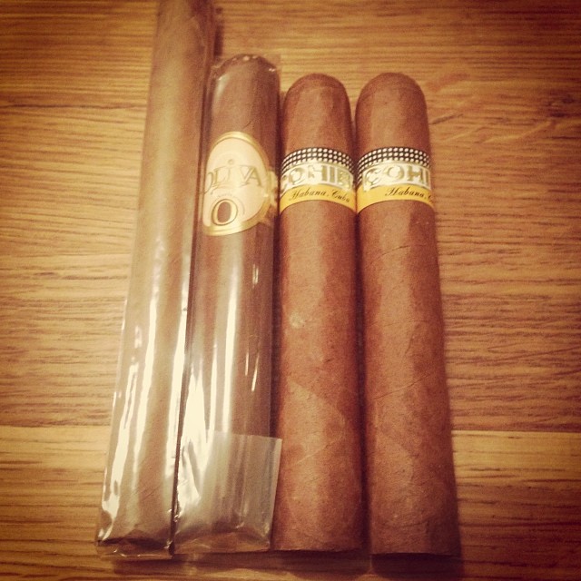 three cigars with the label alil on them