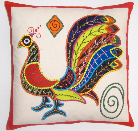 a decorative pillow has an embroidered rooster on it