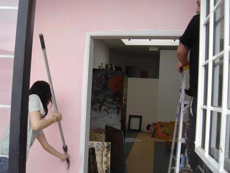 the woman climbs up to the loft on a ladder