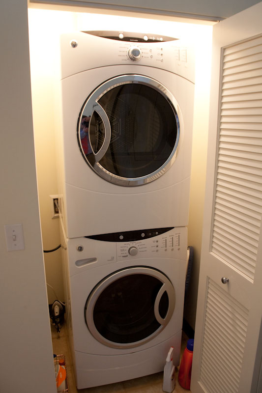 the washer and dryer are on display near the door