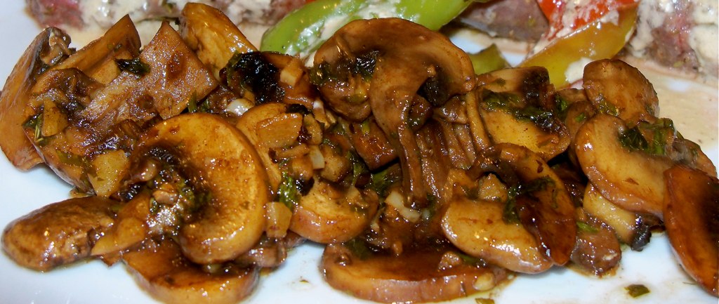 mushrooms are cooked on top of each other on a plate
