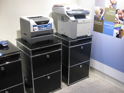there is a pile of different color and size printers