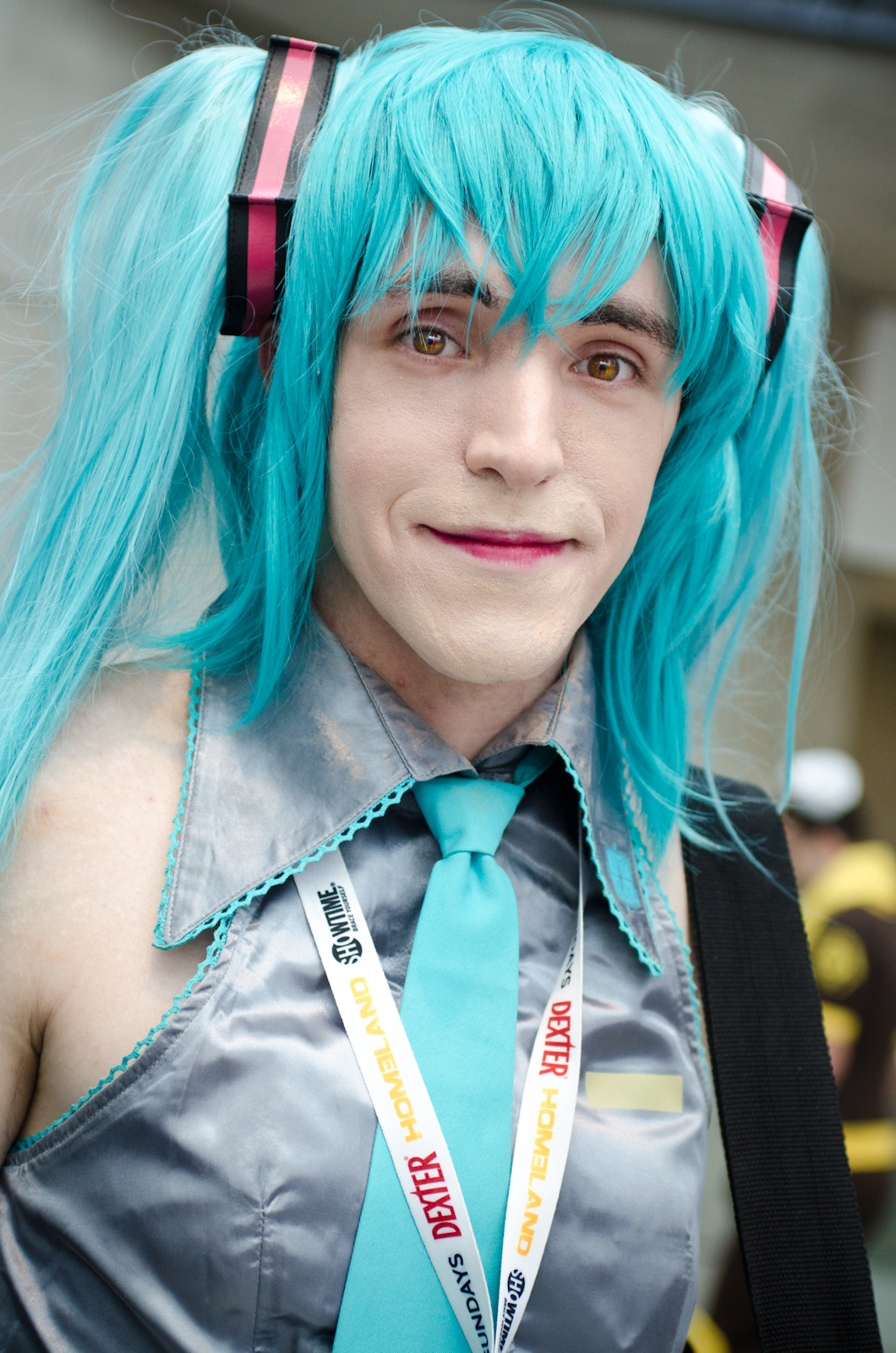 the young man with the green hair and blue hair is dressed in a tie