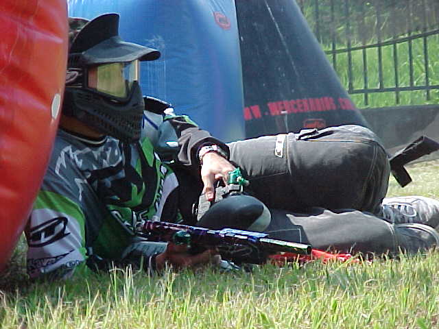 a person wearing a helmet laying on the ground