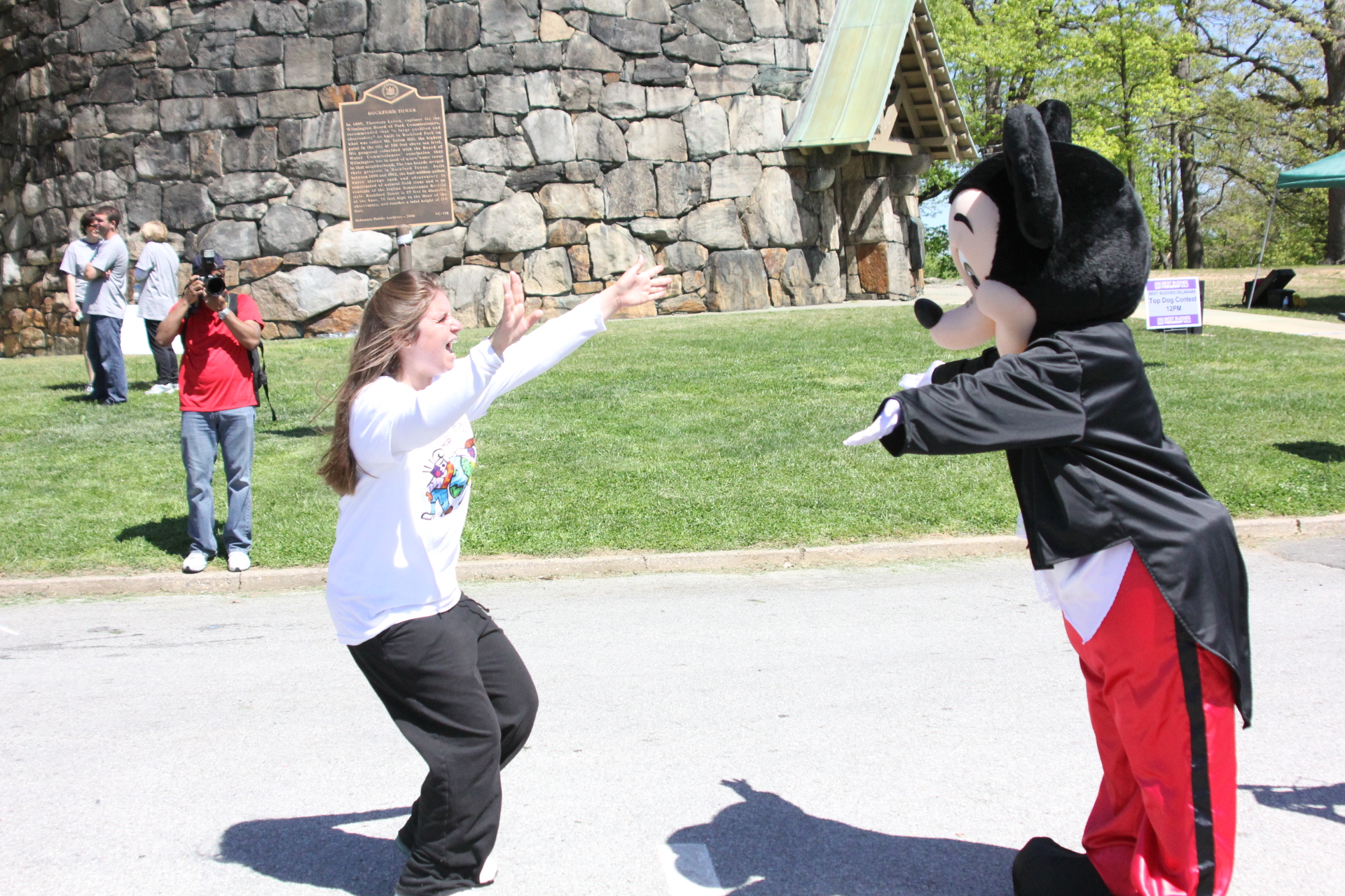 two s playing in the middle of a park while wearing costume