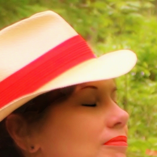 a woman in a white red and black hat
