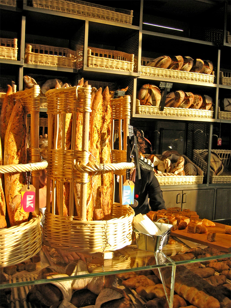 bread and pastries on display in a market