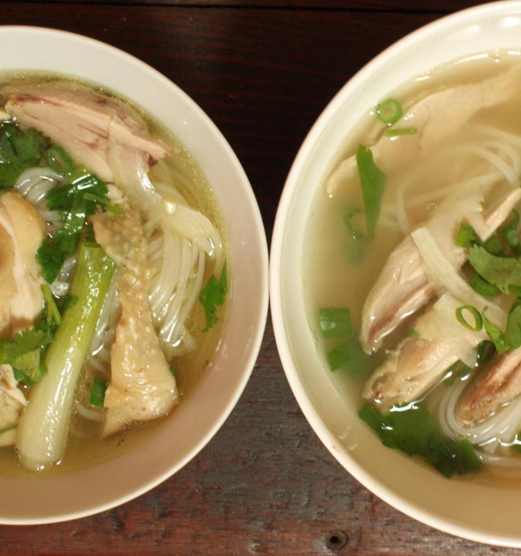 two bowls filled with soup and noodle soup