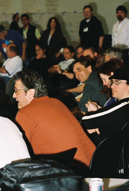 a group of people sitting down next to each other