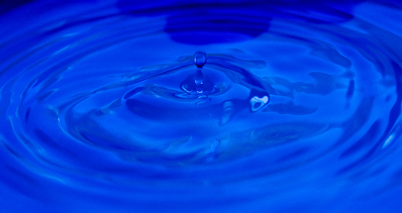 blue water ripples around a large, circular object