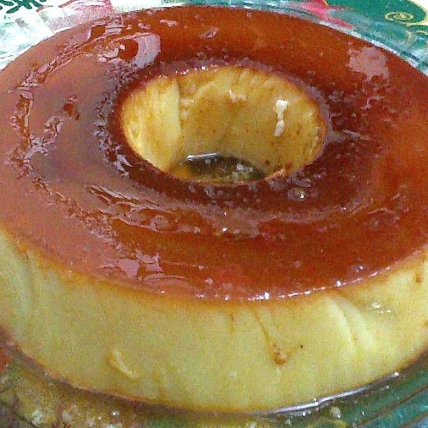 a round pastry with sauce that has been placed in the middle of it