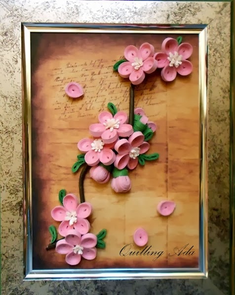 some pink flowers are laying on a page in a frame